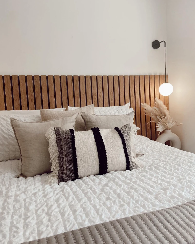 Natural Wood Slat Headboard with Woven Textured Bedding