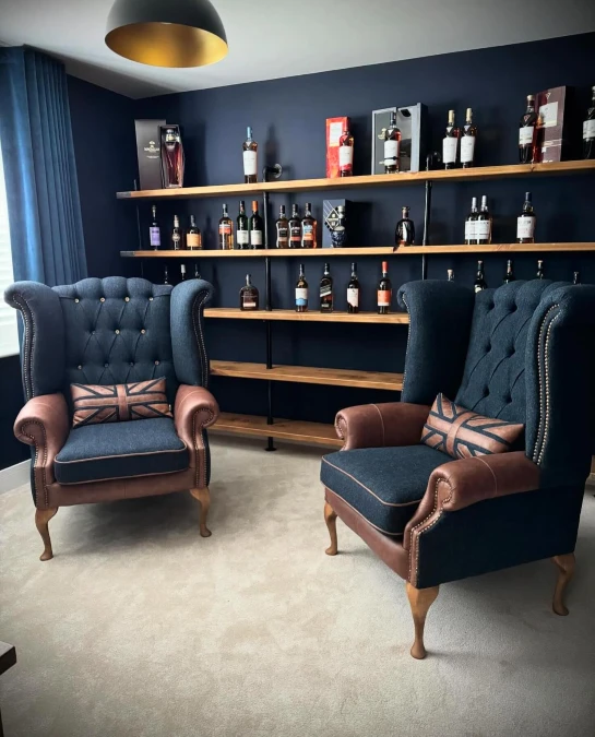 Navy Wingback Chairs with Industrial Pipe Shelving