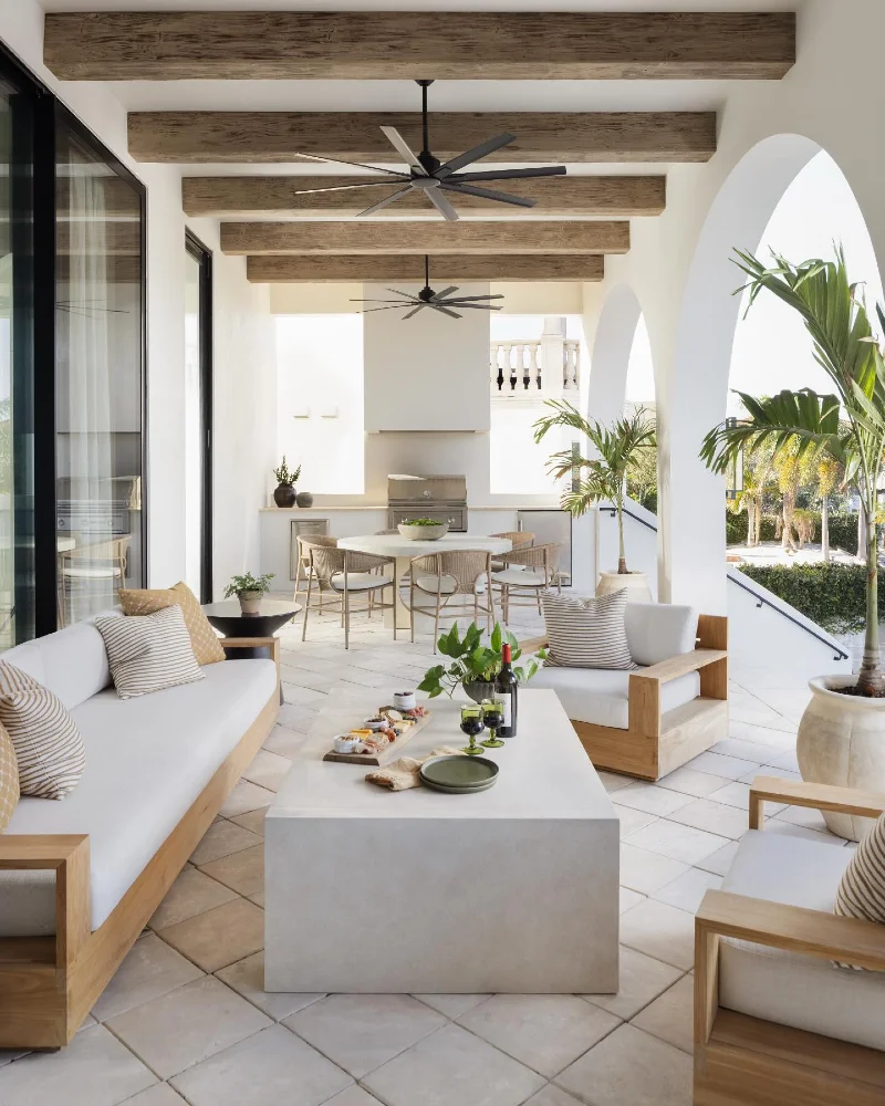 Oak Wood Sofas with Monolithic Concrete Coffee Table and Stucco Arches