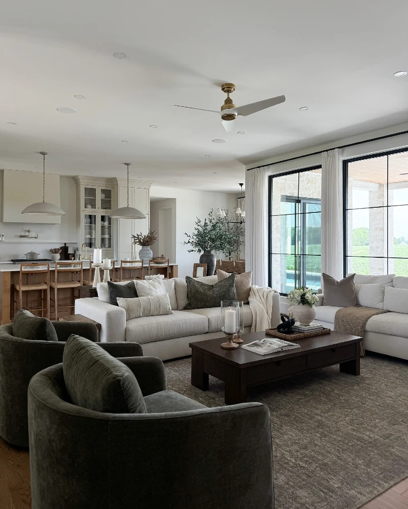 Open Concept Living Room with Charcoal Accent Chairs and Dark Wood Coffee Table