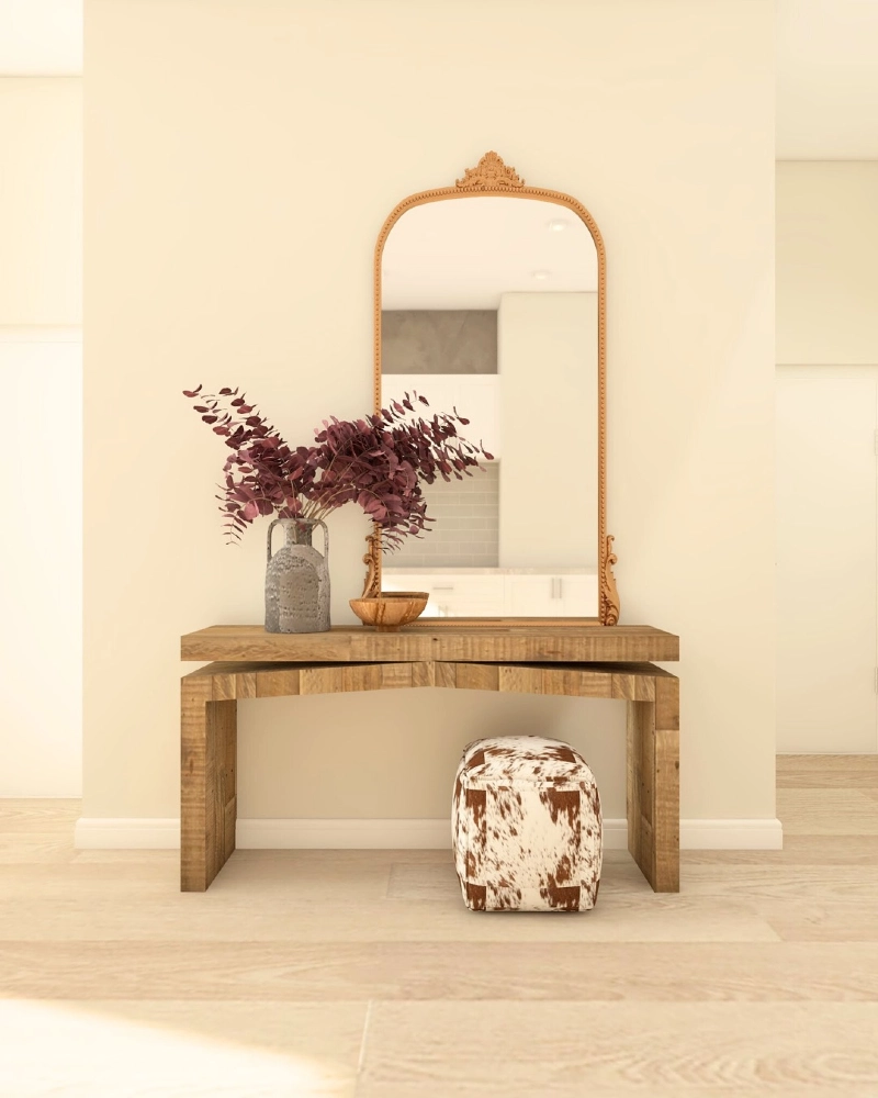  Ornate Gold Mirror with a Rustic Console and Cowhide Stool