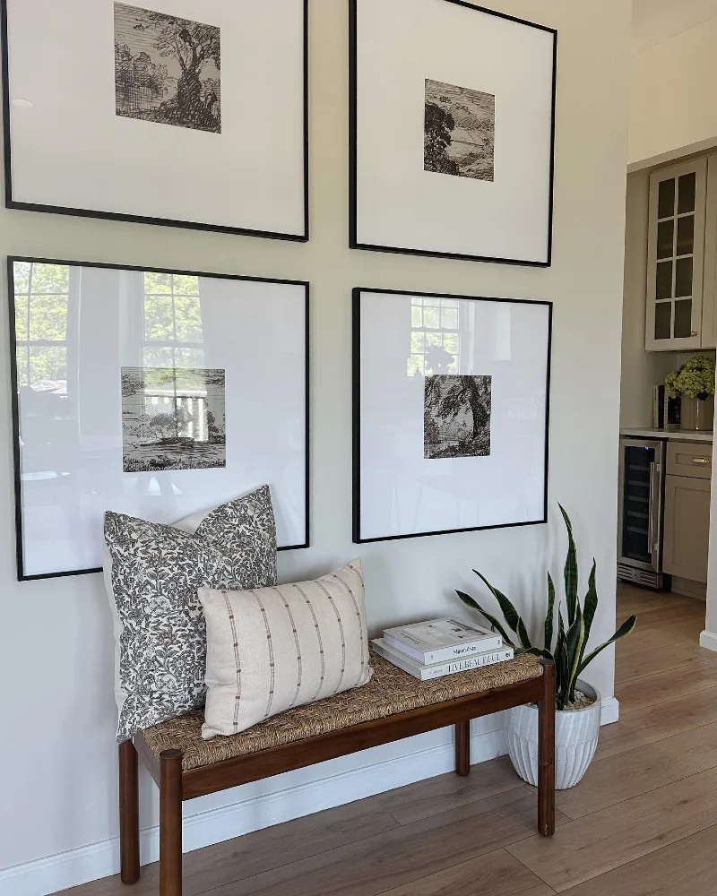 Oversized Grid Gallery Wall with Monochromatic Ink Sketches and Woven Rush Bench