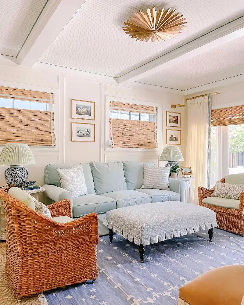 Pale Aqua Sofa with Woven Wicker Armchairs and Ruffled Patterned Ottoman