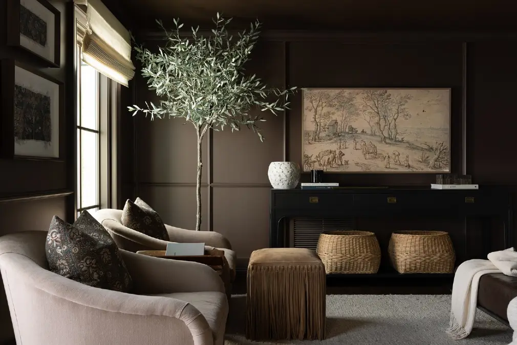 Pale Armchairs Contrast Against Dark Chocolate Paneling