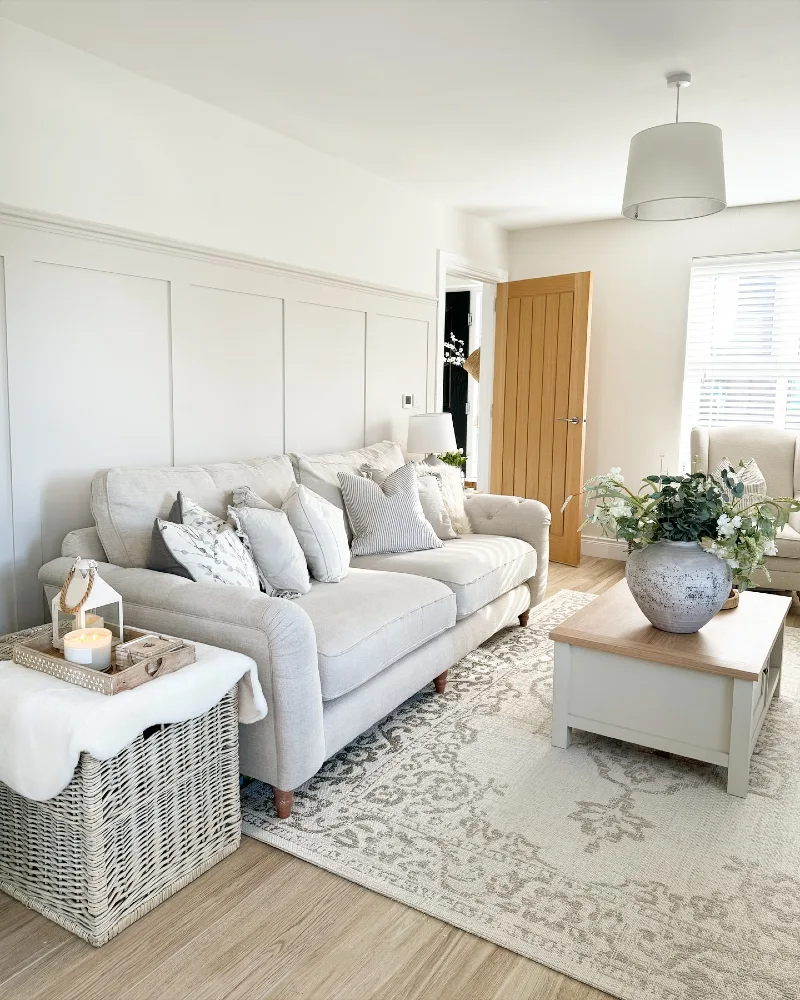Paneled Walls with a Soft Linen Sofa and Light Oak Coffee Table