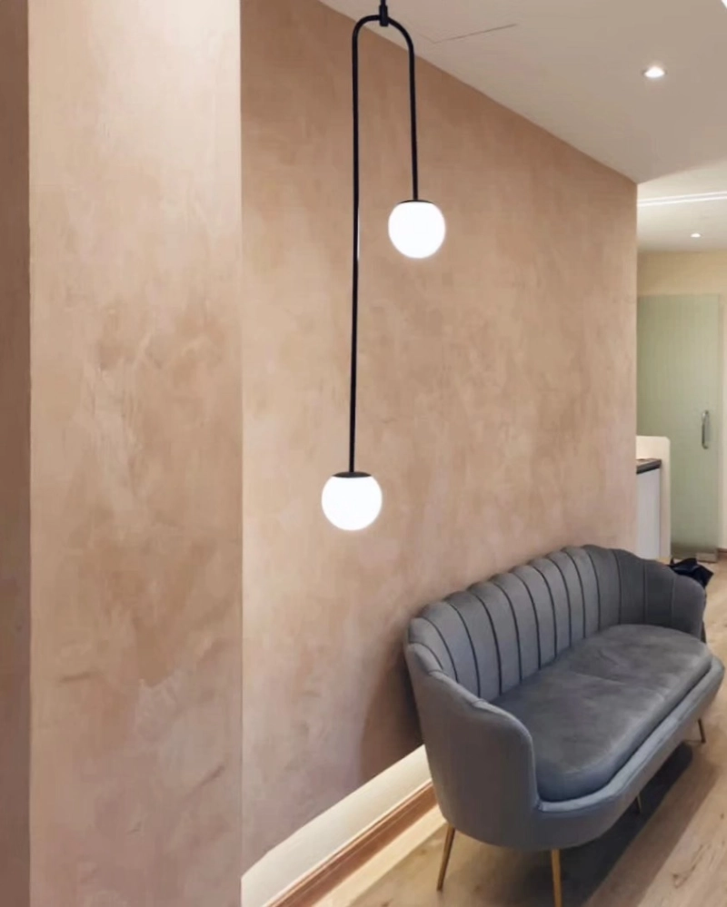 Peach-Toned Plaster Wall with Velvet Settee