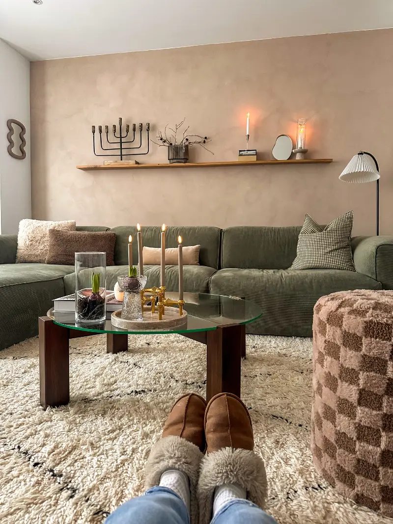 Plaster-Effect Wall with Floating Shelf and Olive Sectional