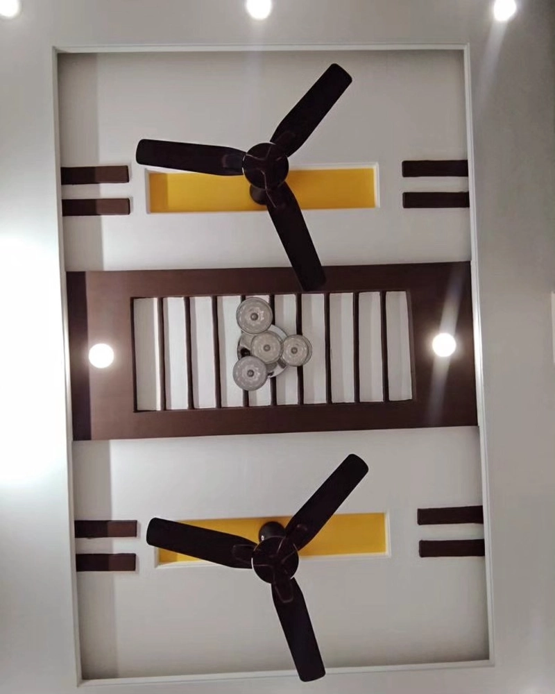 Recessed Plaster Ceiling with Yellow and Brown Architectural Slats, Dual Fans, and Central Glass Light