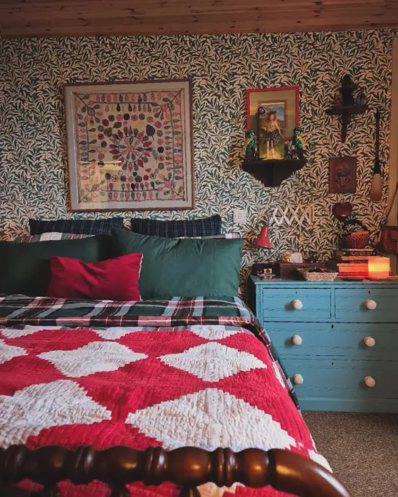 Red and White Diamond Quilt with Leaf Pattern Wallpaper and Vintage Blue Dresser