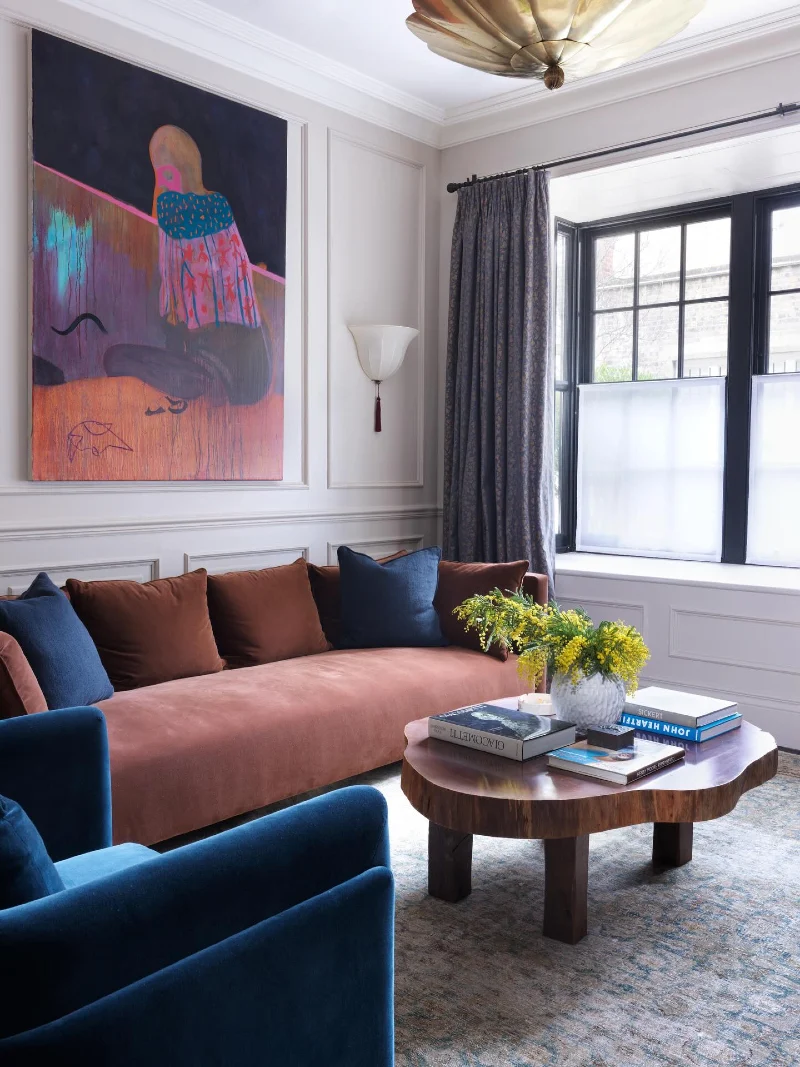 Rose Velvet Sofa with Sapphire Chairs and Oversized Art
