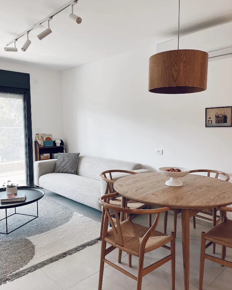 Round Oak Dining Table with Wishbone Chairs and a Wood Drum Pendant