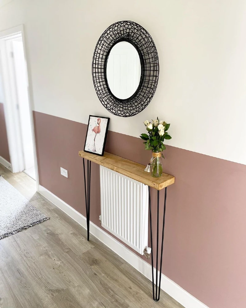 Round Woven Wire Mirror Above Two-Tone Mauve Paint with Hairpin Console Table