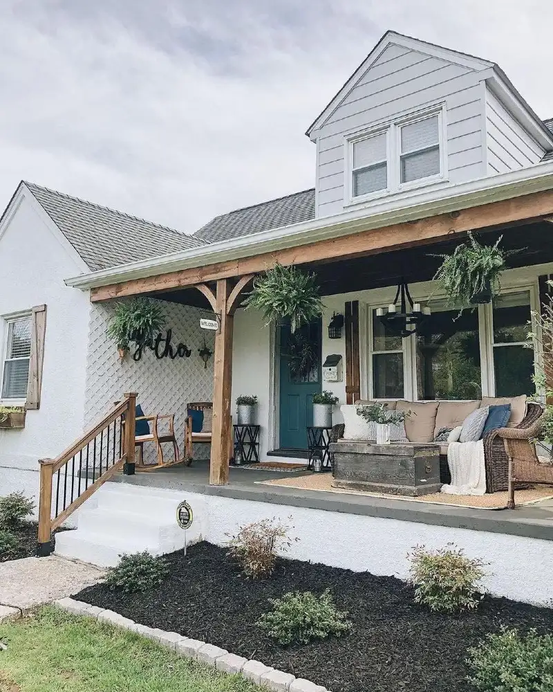 Rustic Timber Porch with Hanging Ferns and a Weathered Trunk Table