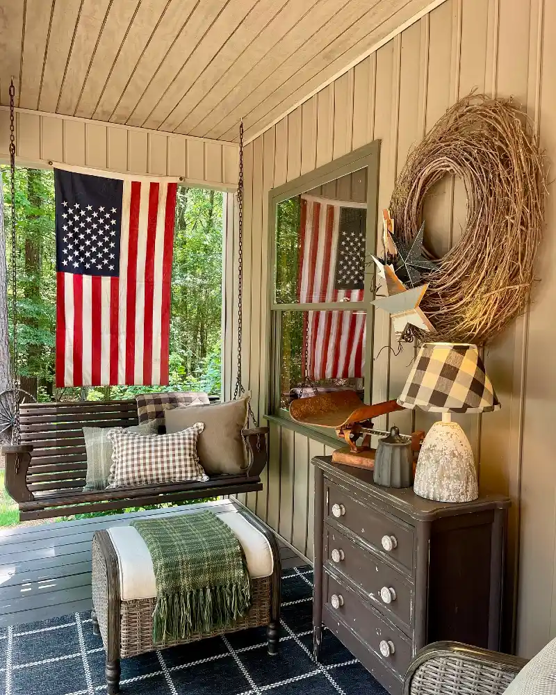 Rustic Wooden Porch Swing with Weathered Dresser and Grapevine Wreath