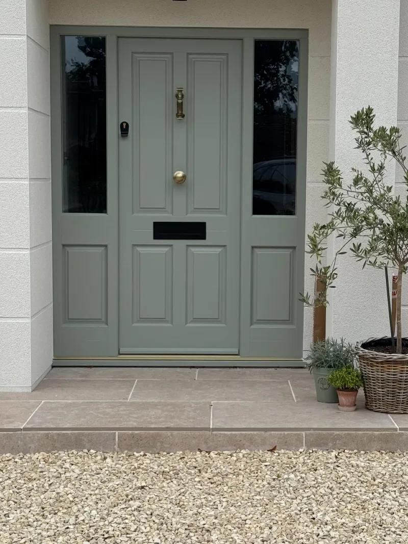  Sage Gray Front Door with Dark Glass Sidelights and Aged Brass Details