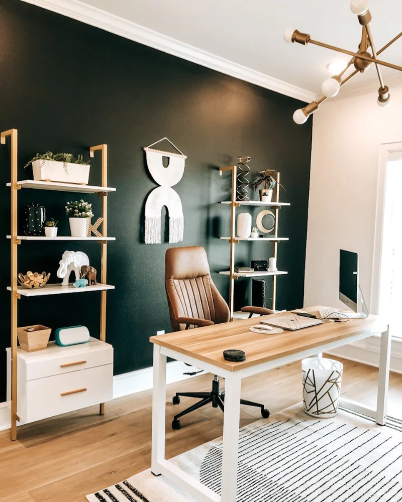 Satin Obsidian Office Backdrop with Brass Open Shelving and Cognac Leather Chair