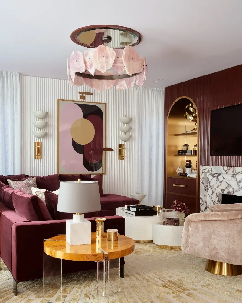 Sculptural Chandelier and Burgundy Accents in a Modern Living Room