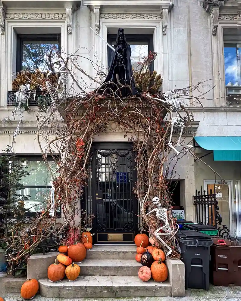 Sculptural Twig Archway with Heirloom Pumpkins and Climbing Skeletons