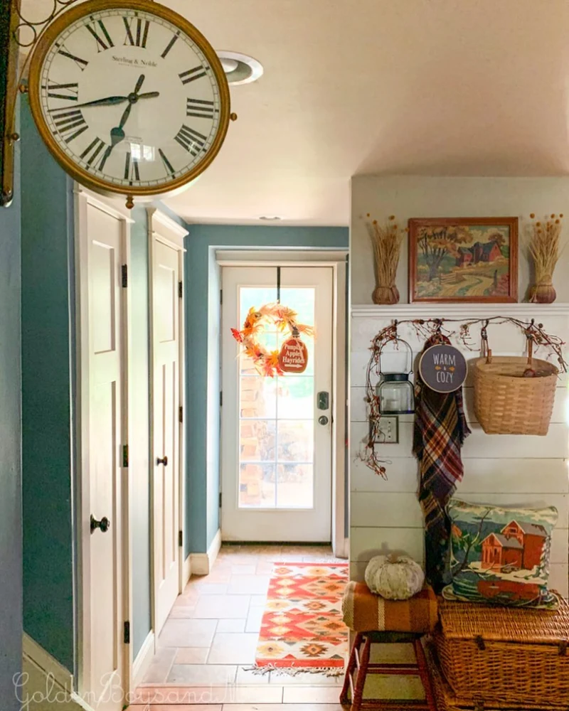 Shiplap Accent Wall with Woven Storage Trunk, Plaid Scarf, and Vintage Barn Artwork