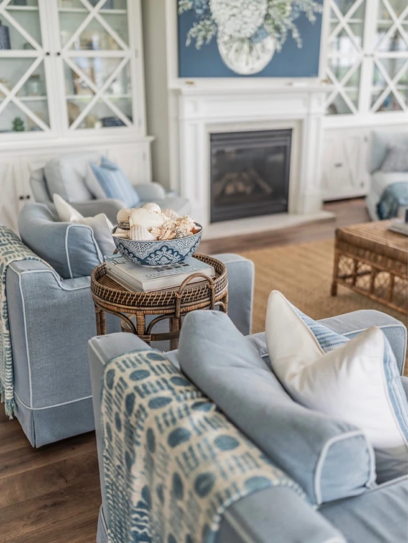 Slate Blue Armchairs with Rattan Side Table and Ceramic Shell Bowl