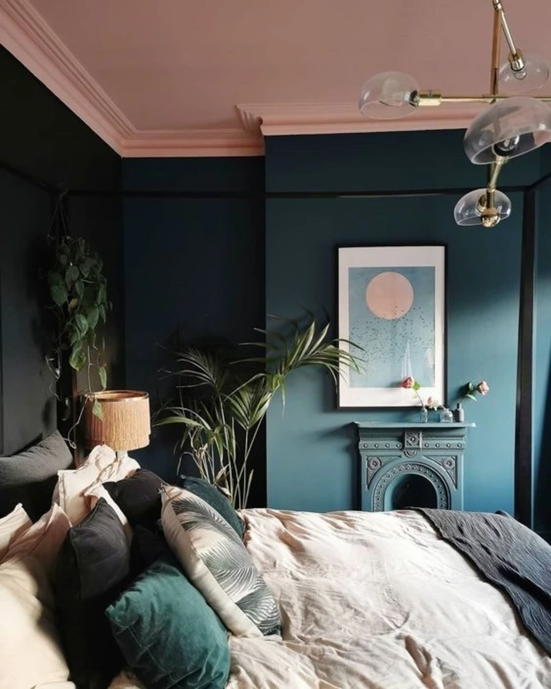Soft Blush Ceiling and Crown Molding with Saturated Teal Walls and Vintage Fireplace Surround