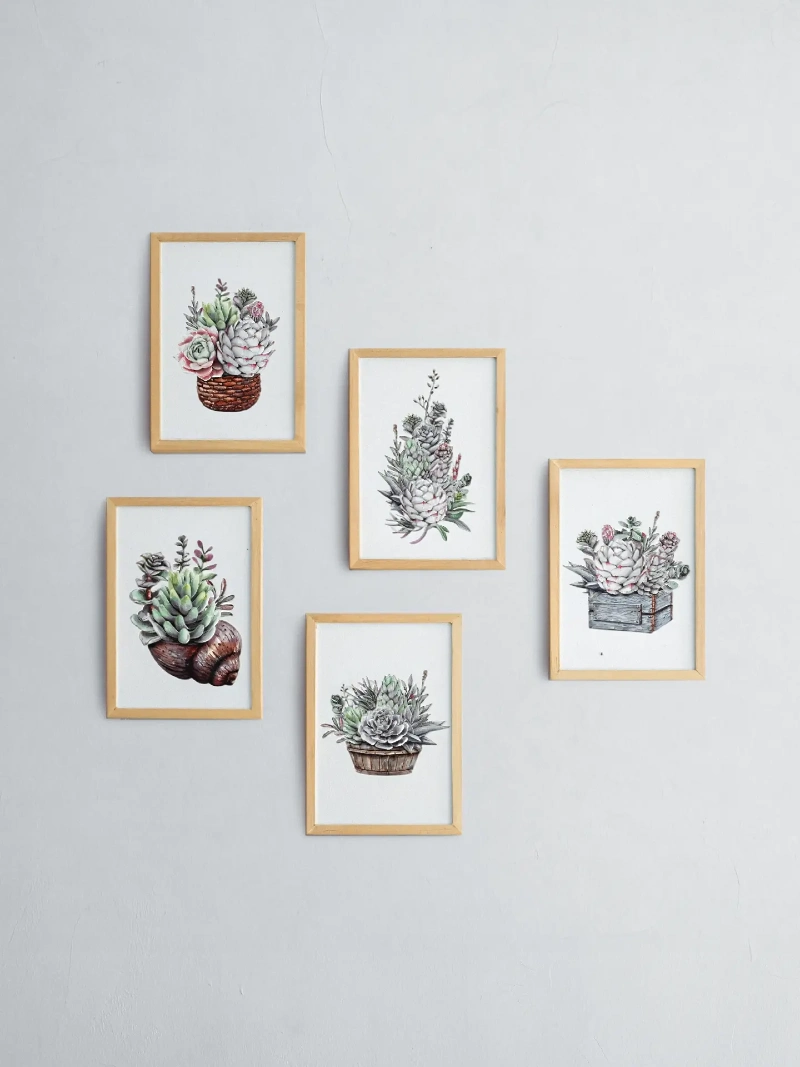Staggered light wood frames with botanical succulent watercolor prints