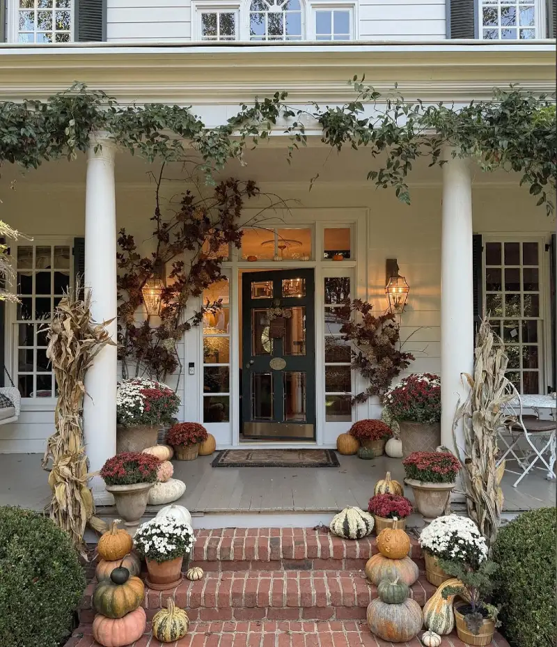Stately Southern Veranda with Wisteria Vines, Red Brick Steps, and Stacked Heirloom Gourds