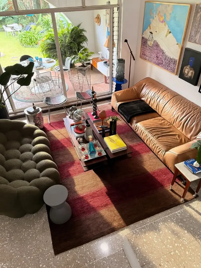 Tan Leather Sofa with Tufted Olive Lounge Chair and Layered Linear Coffee Table