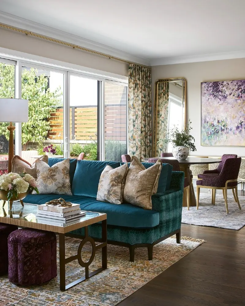 Teal Velvet Sofa with Lavender Artwork and Plum Accent Stools
