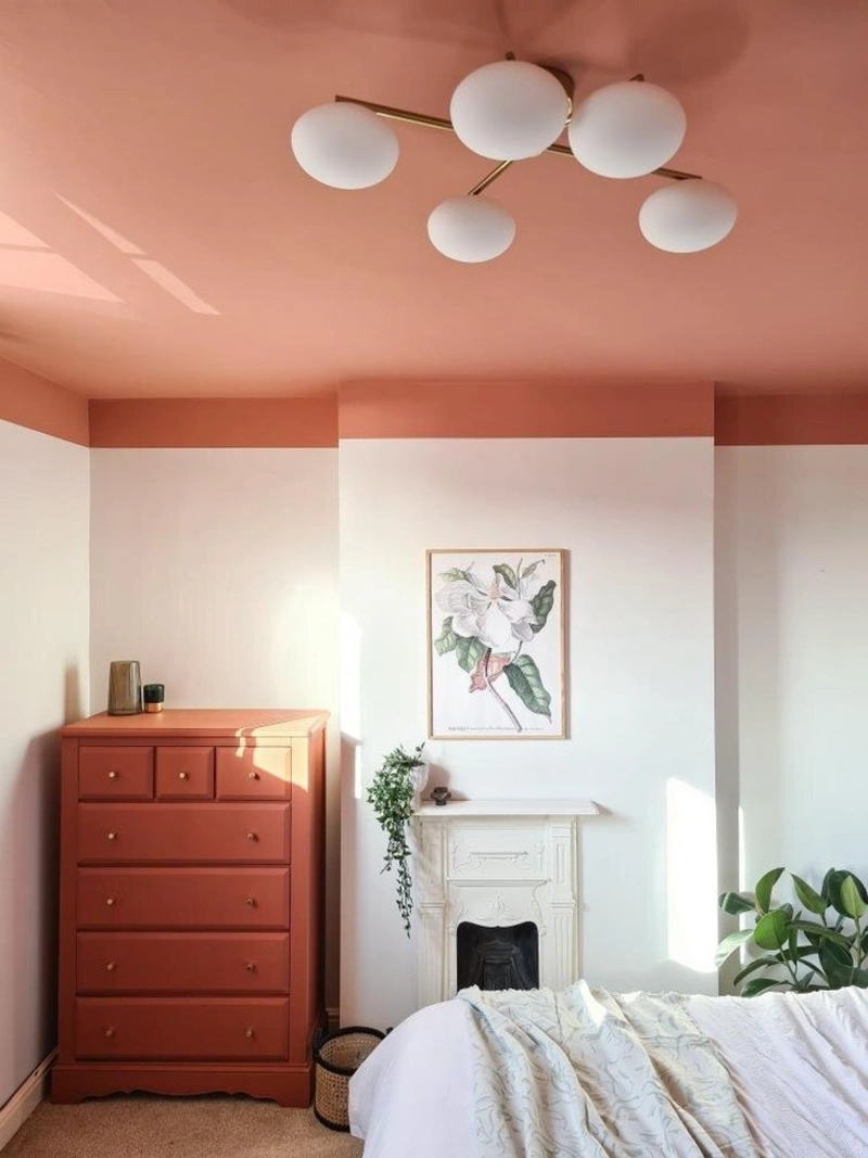 Terracotta Painted Ceiling Band with Matching Wooden Dresser and Brass Globe Chandelier