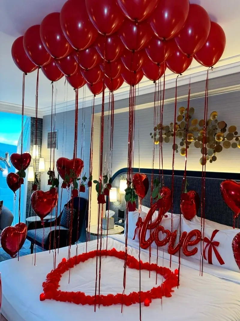 Textured Navy Headboard with Script Love Foil Balloon and Hanging Single Roses