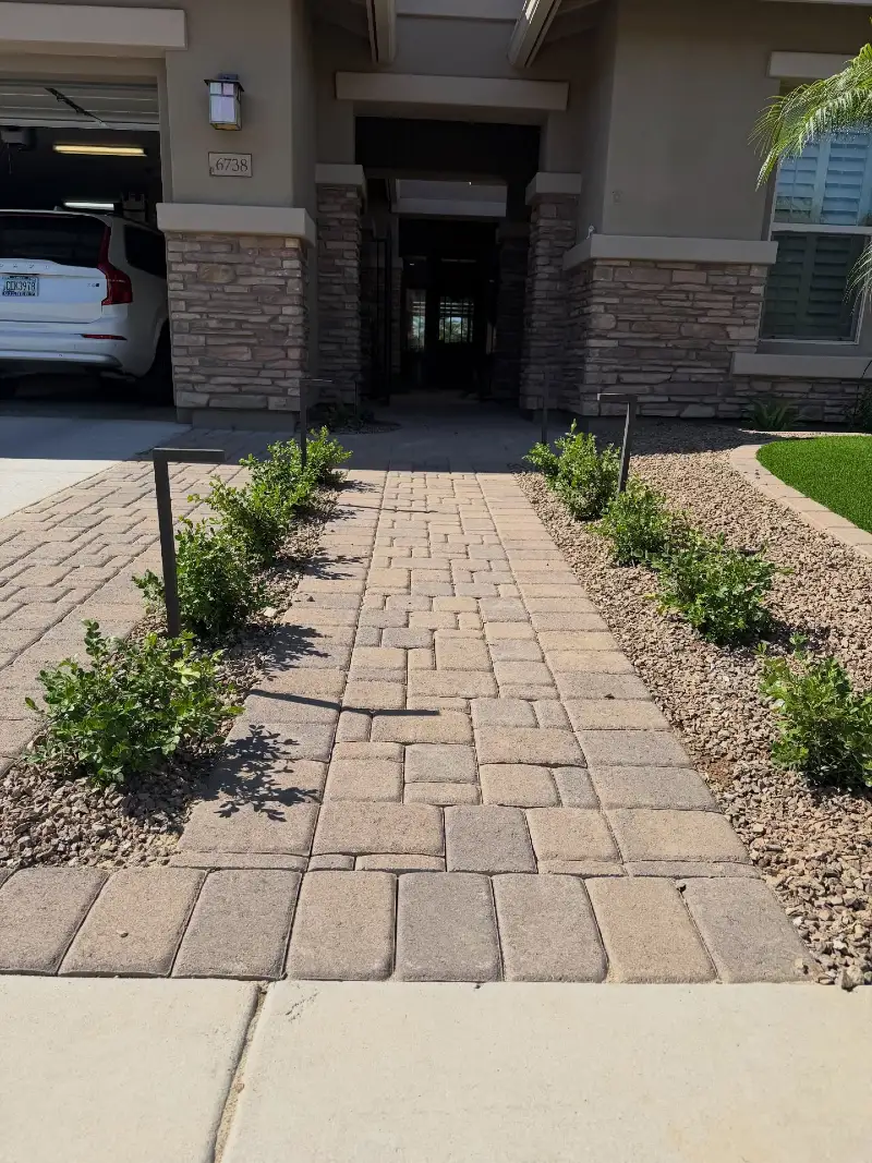 Textured Paver Walkway with Gravel Beds and Minimal Green Borders