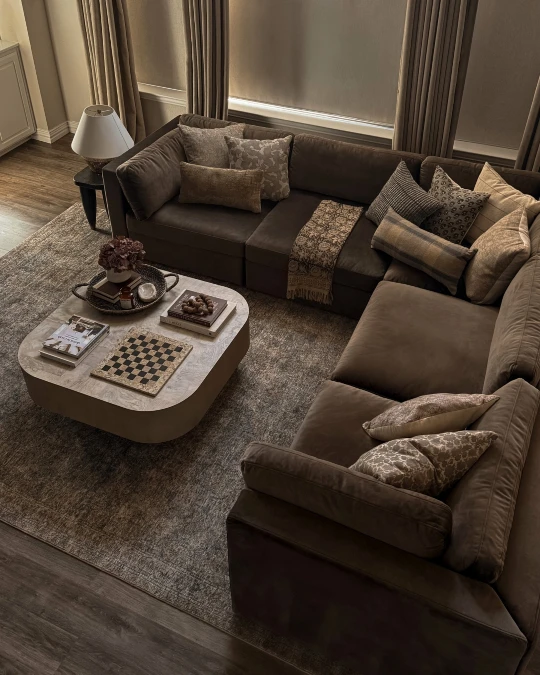 Textured Pillows Break Up A Massive Chocolate Sectional