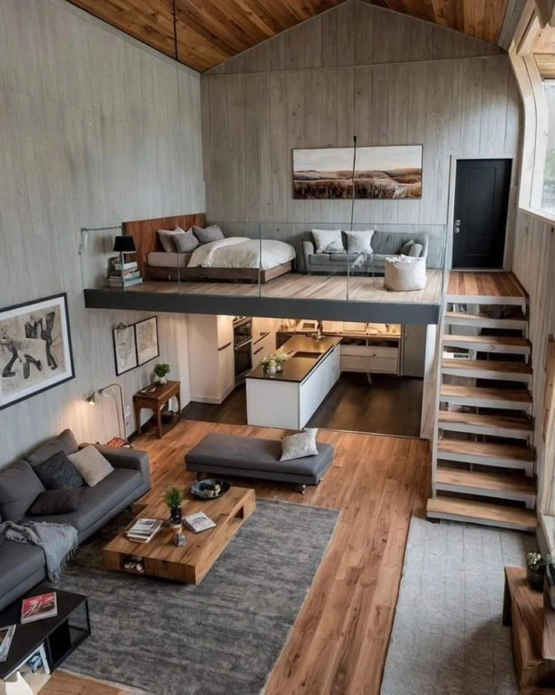 Vaulted timber ceiling with glass mezzanine bedroom and open kitchen below