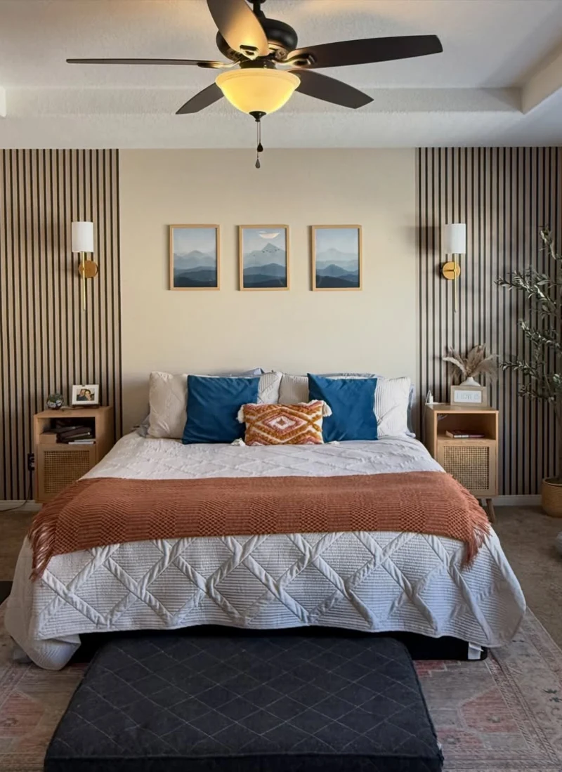 Vertical wood slat accent panels flanking framed mountain prints