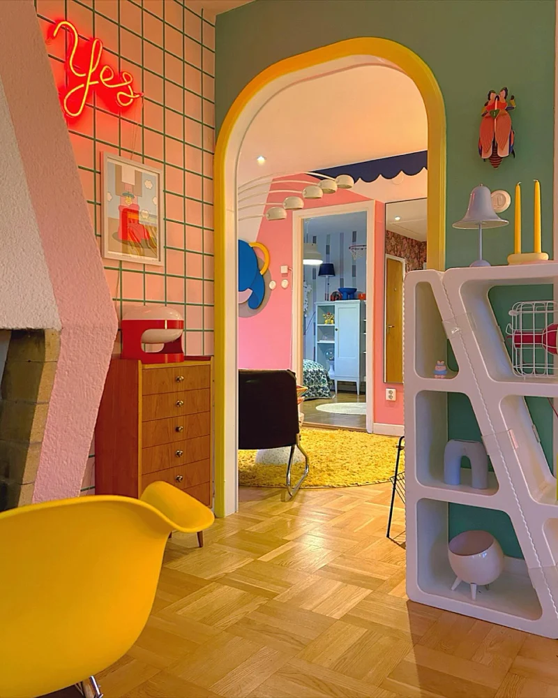 Vibrant Archway Entryway with Grid-Patterned Walls and Yellow Accents
