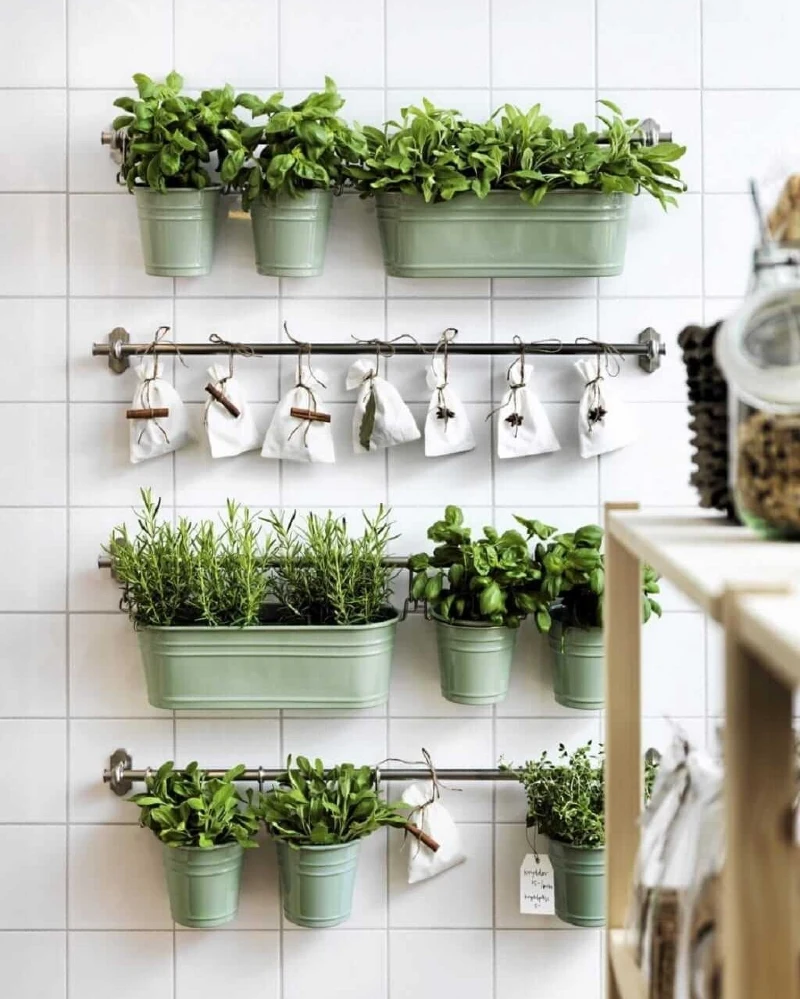 Wall-Mounted Kitchen Utility Rails with Mint Green Herb Planters and Linen Spice Sachets