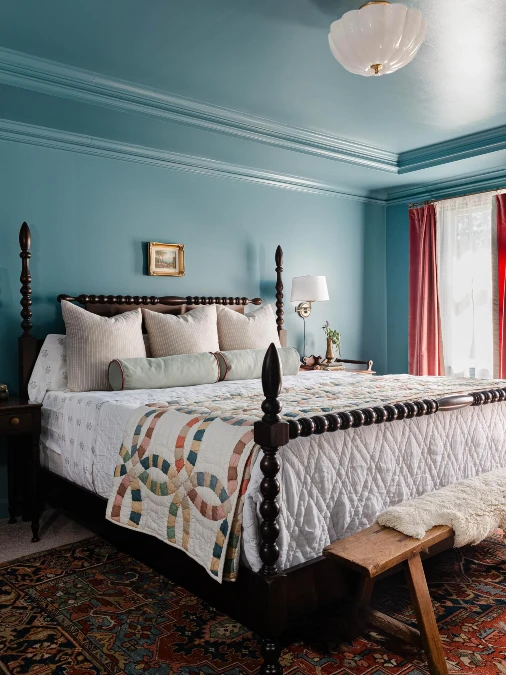 Warm Teal Bedroom With Vintage Wood Furniture