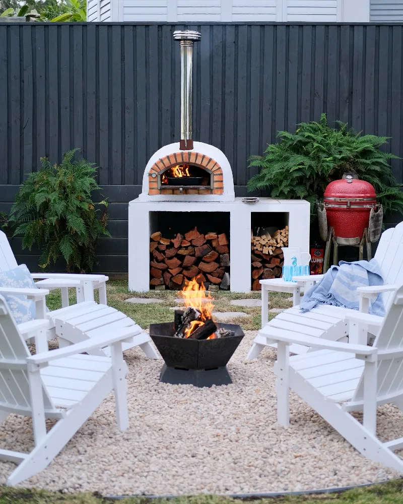 White Adirondack Fire Circle with Backyard Pizza Oven and Wood Storage