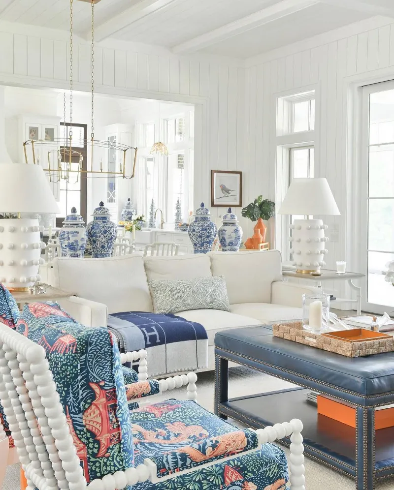 White Bobbin Accent Chairs with Navy Leather Ottoman and Chinoiserie Ginger Jars