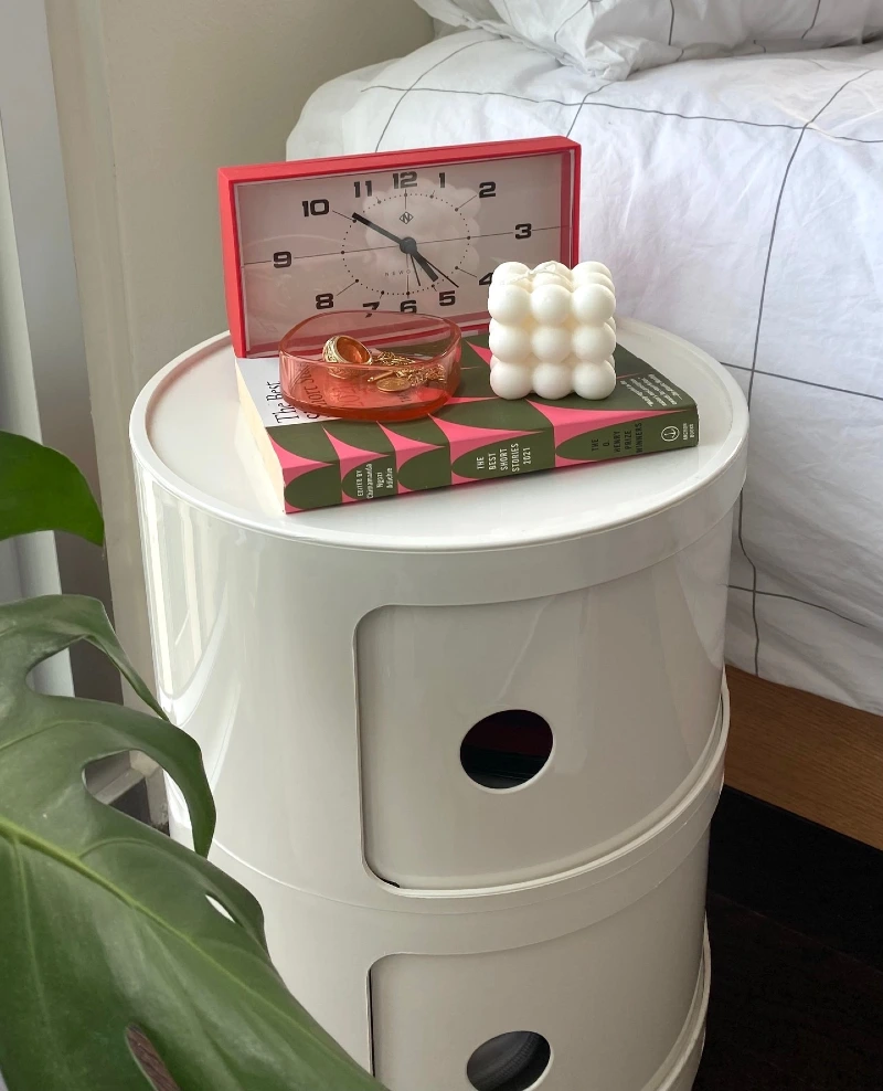 White Cylindrical Componibili Nightstand with Graphic Book and Retro Accents