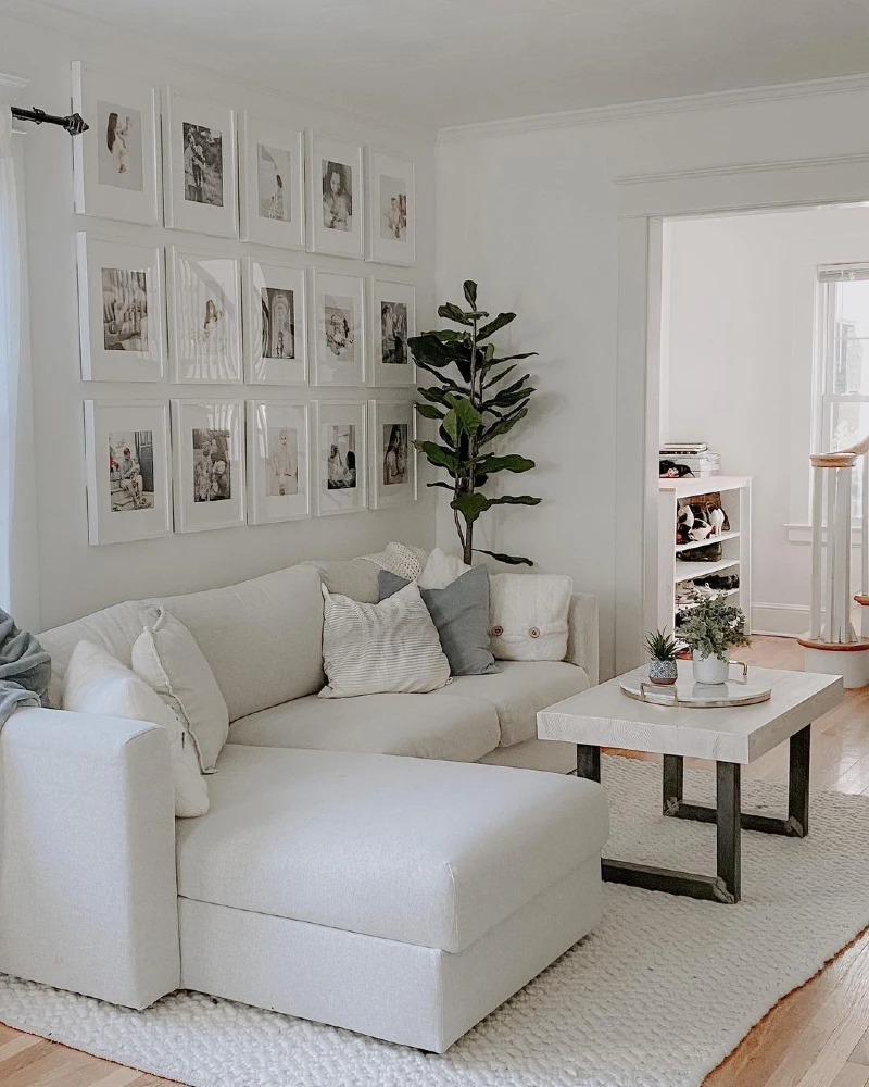 White Gallery Wall with a Linen Sectional and Black Metal Coffee Table