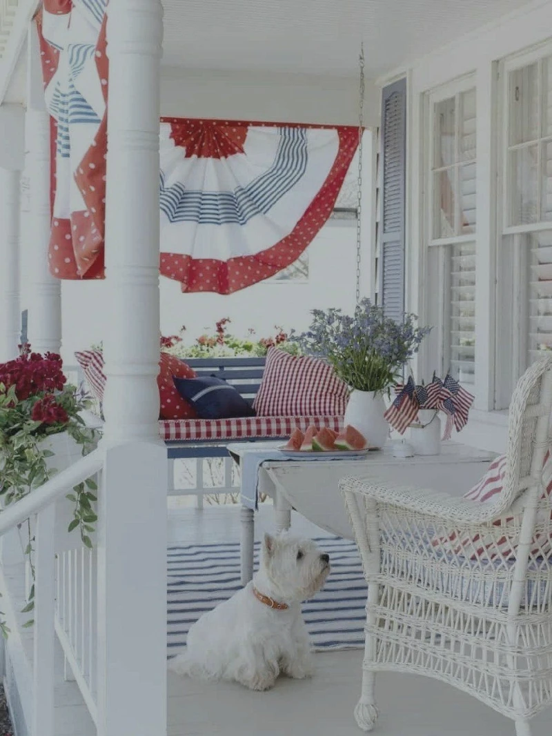 White Wicker Armchair with Red Gingham Bench and Blue Striped Runner