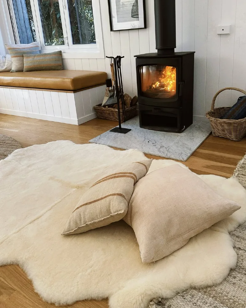 Wood Stove with Marble Hearth and Sheepskin Floor Layering