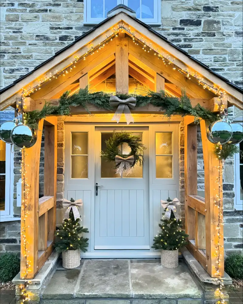 Wooden Gable Porch with Cluster Fairy Lights, Silver Baubles, and Burlap Bows