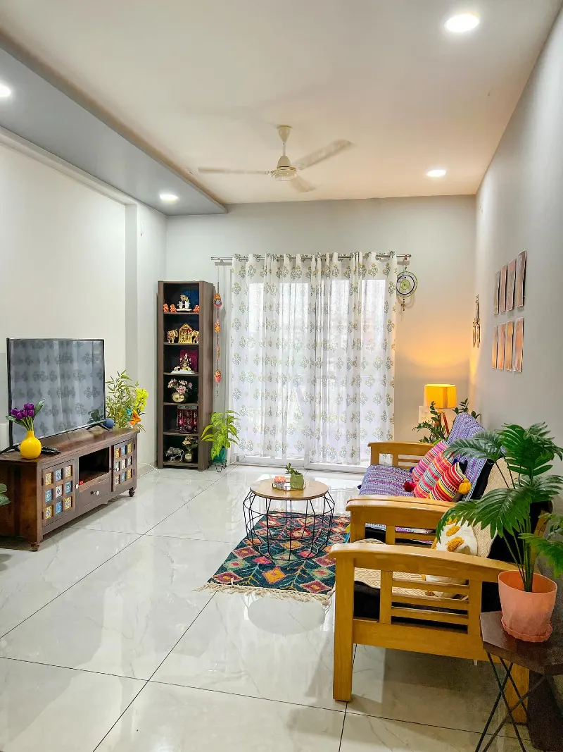 Wooden Sofa with Tiled Media Console and Colorful Geometric Rug