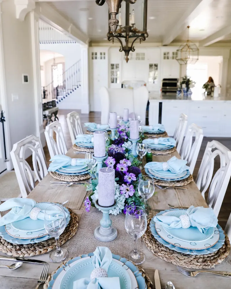 Woven Chargers and Soft Blue Linens with Purple Floral Runner