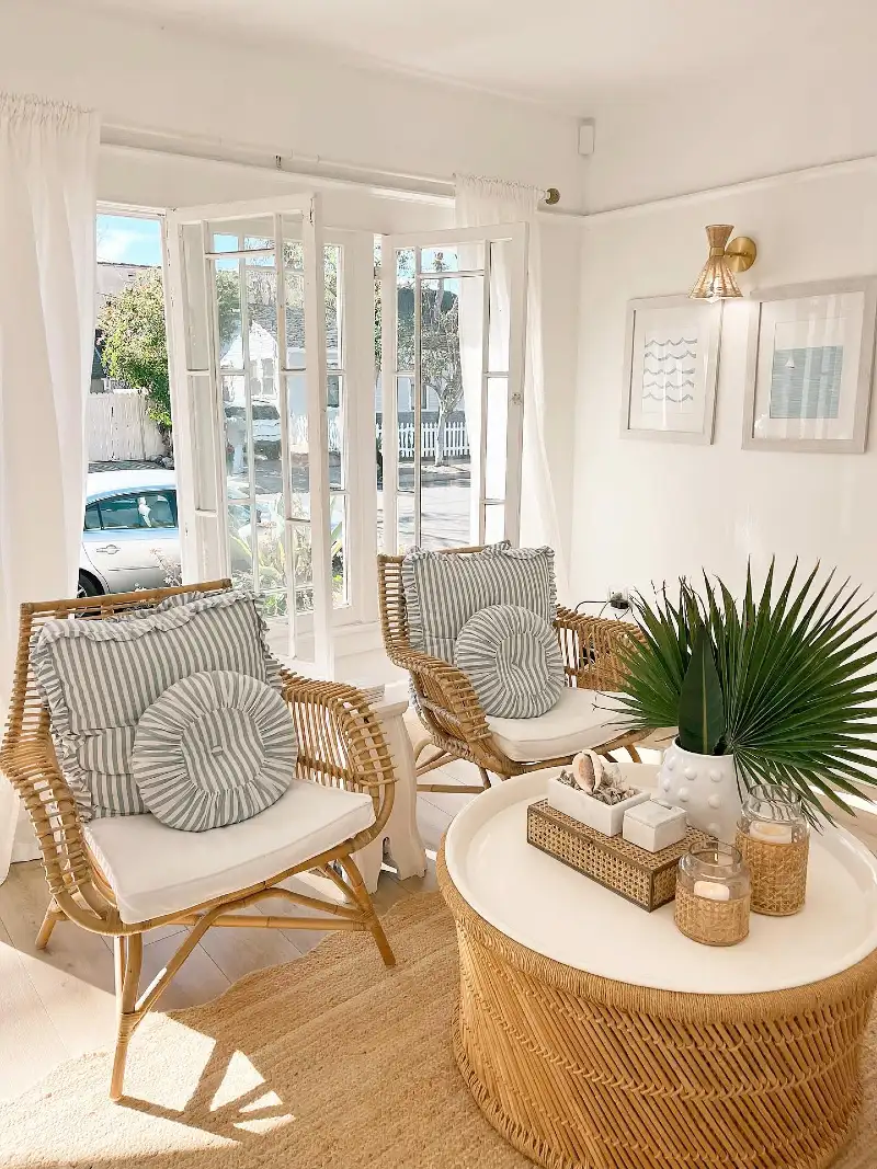 Woven Rattan Armchairs with Ticking Stripe Cushions and Fan Palm Centerpiece