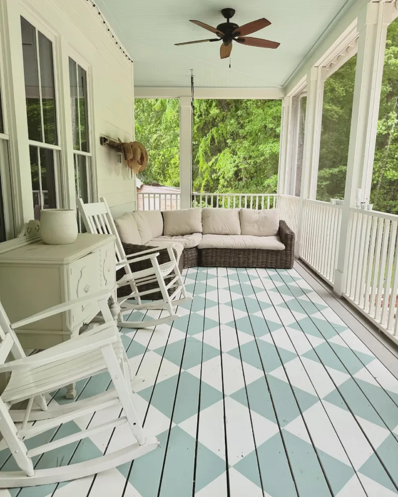 Woven Sectional with Blue Geometric Painted Floor and White Rocking Chairs