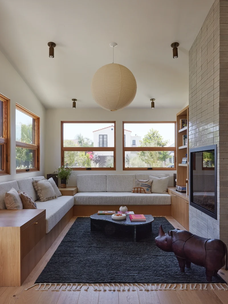 Wraparound Window Bench with Central Fireplace Divider